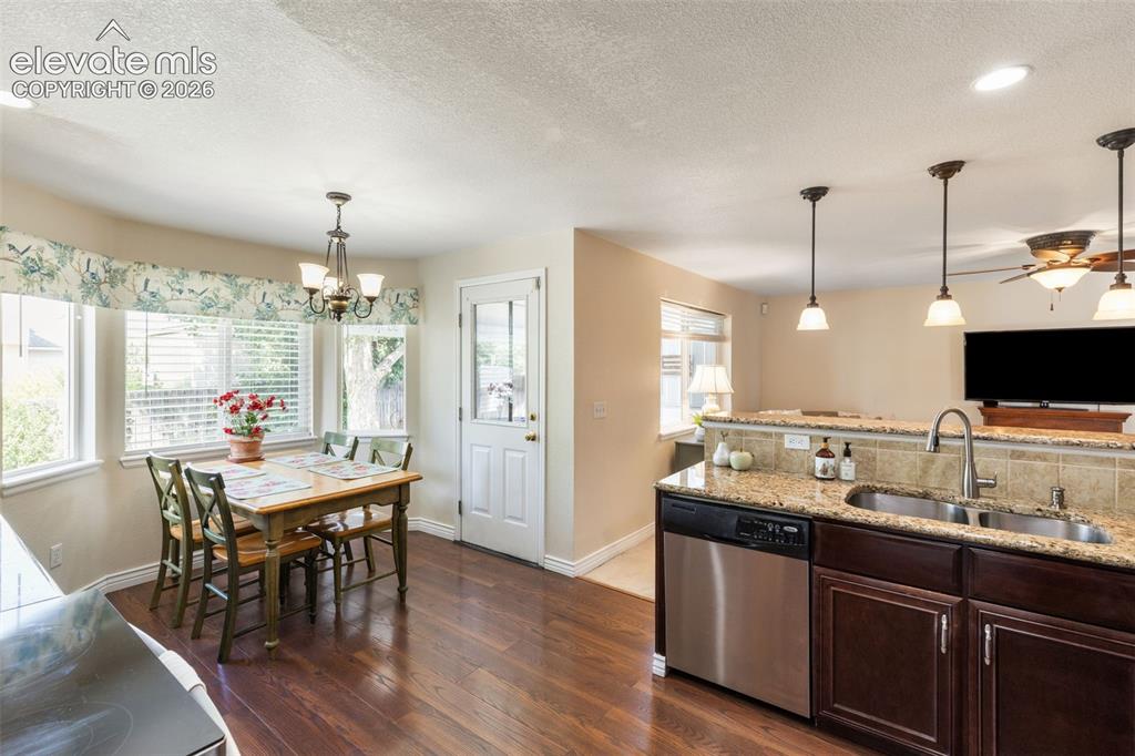 Image 12 of 47: Eat-in kitchen with natural light and a beautiful view of the backyard.