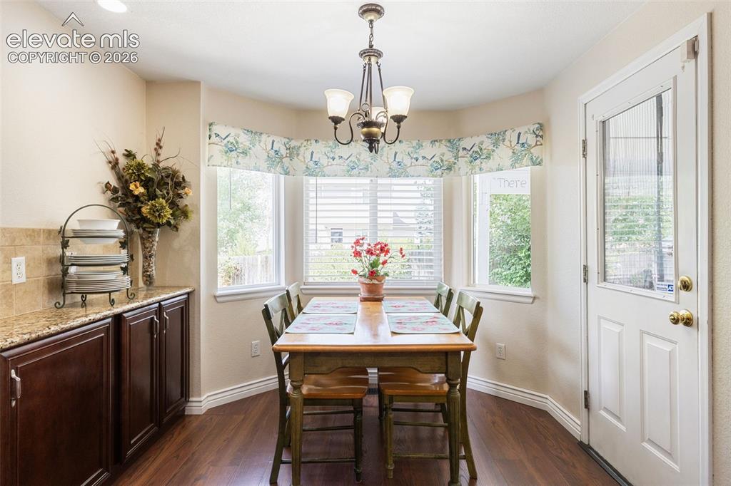 Image 13 of 47: Eat-in kitchen with natural light and a beautiful view of the backyard.