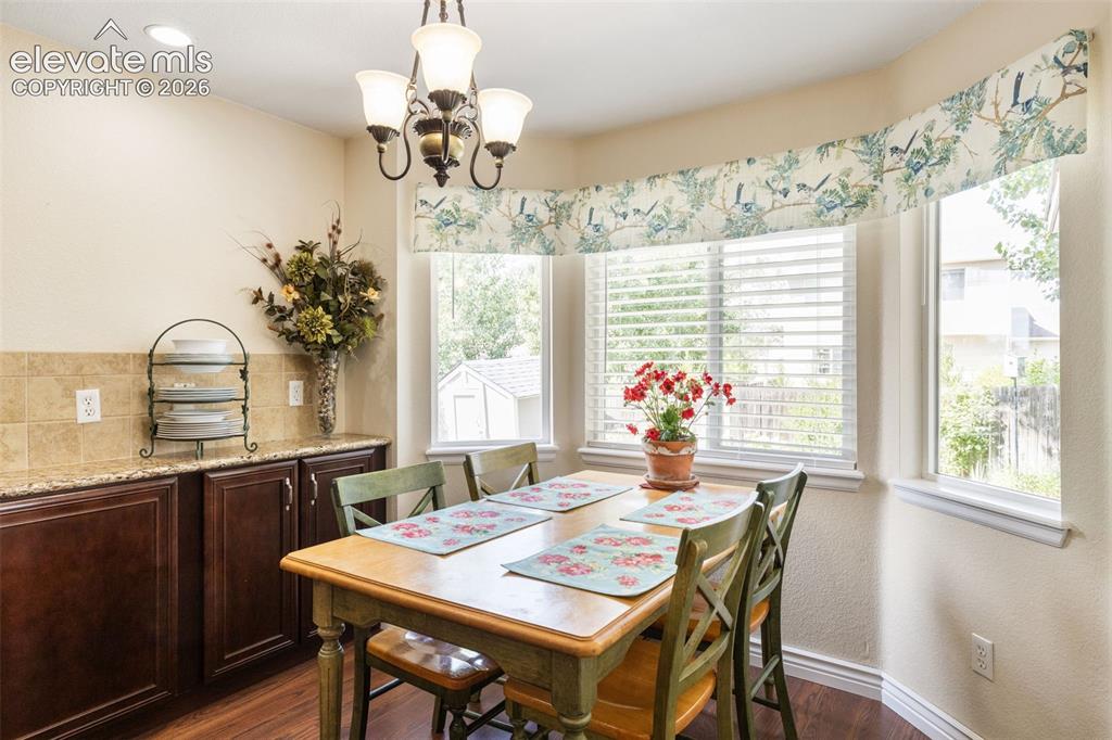 Image 14 of 47: Eat-in kitchen with natural light and a beautiful view of the backyard.