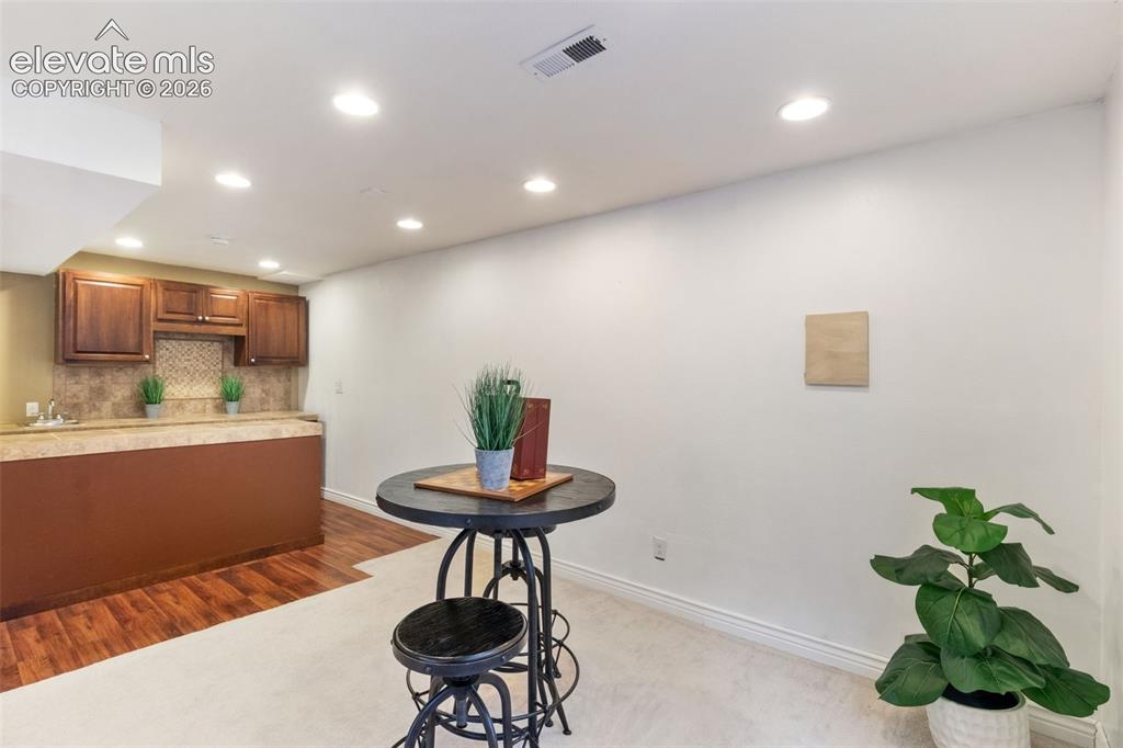 Image 32 of 50: Mulit-use basement space for recreation, living, or non-conforming bedroom