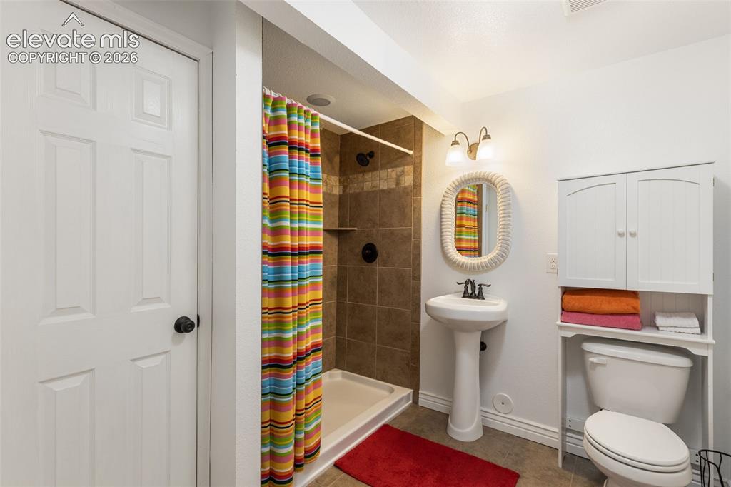 Image 34 of 47: Bathroom with closet.