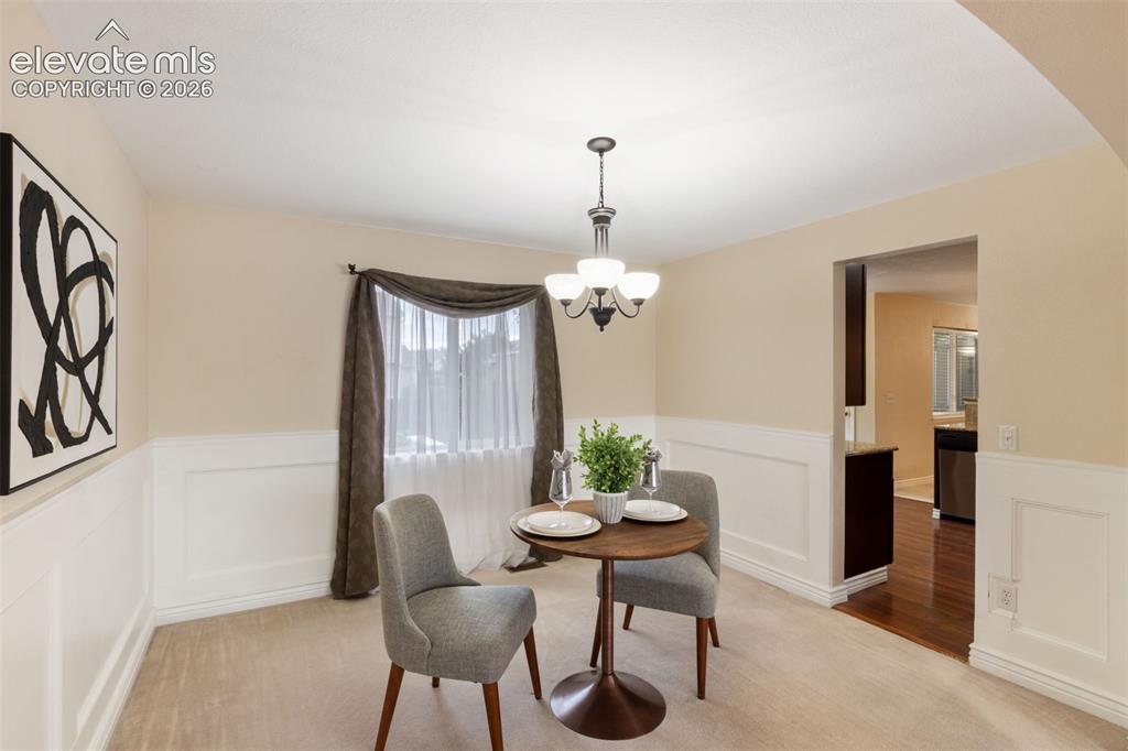 Image 6 of 50: Dining room, connected to living room and access to kitchen