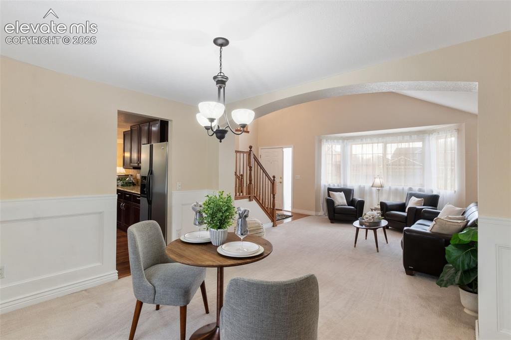 Image 7 of 50: Dining room, connected to living room and access to kitchen