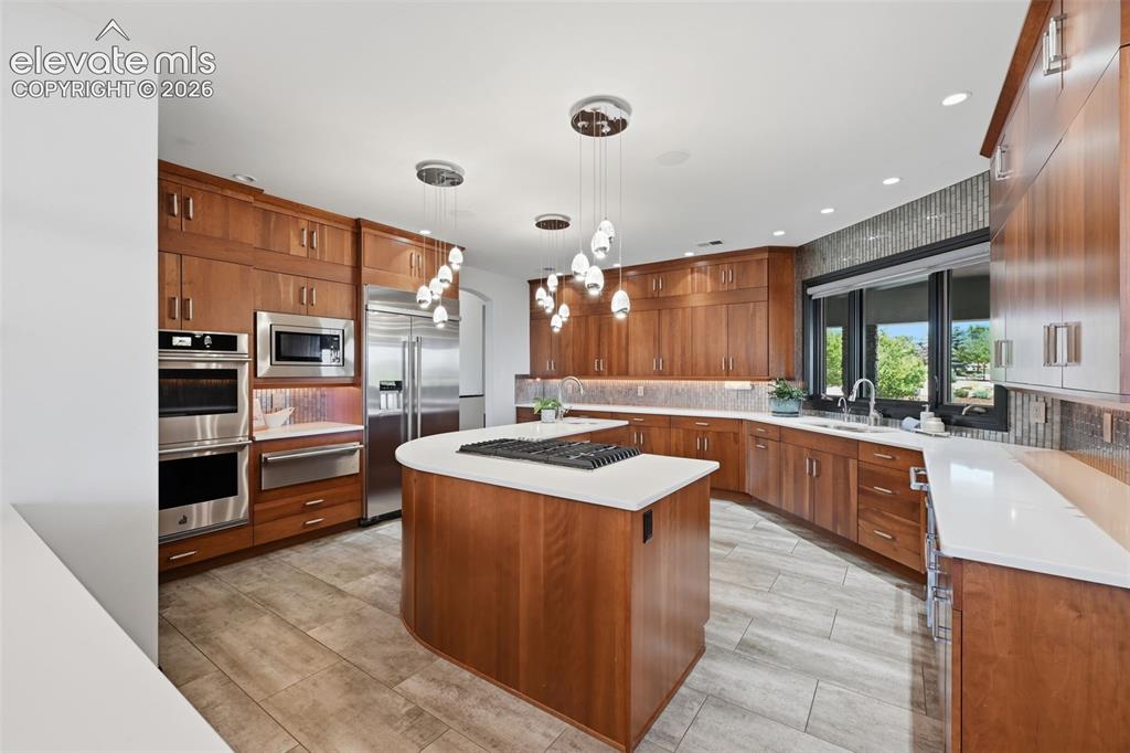 Image 17 of 48: Gas range, warming drawer, double ovens, counter depth refrigerator and vie