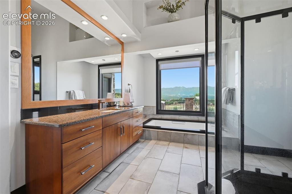 Image 24 of 48: Spa like master bath with more views!