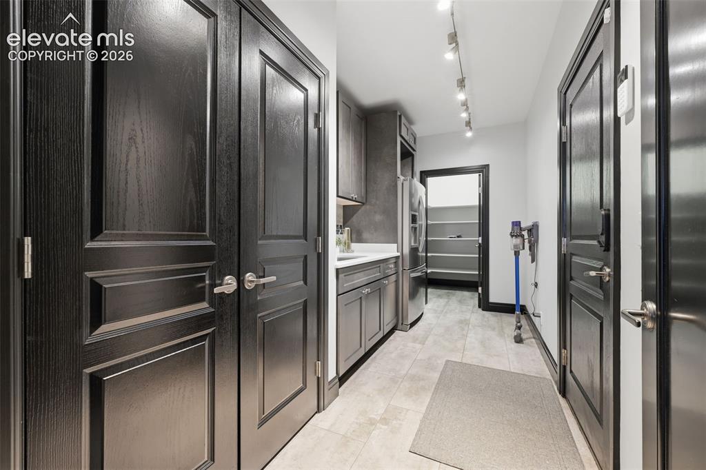 Image 30 of 48: Mud room storage and walk in pantry!