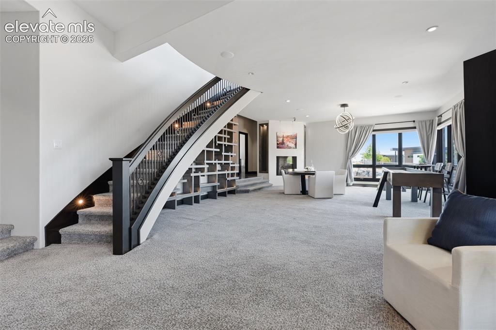 Image 32 of 48: One of two stairs to the basement with fireplace and 11