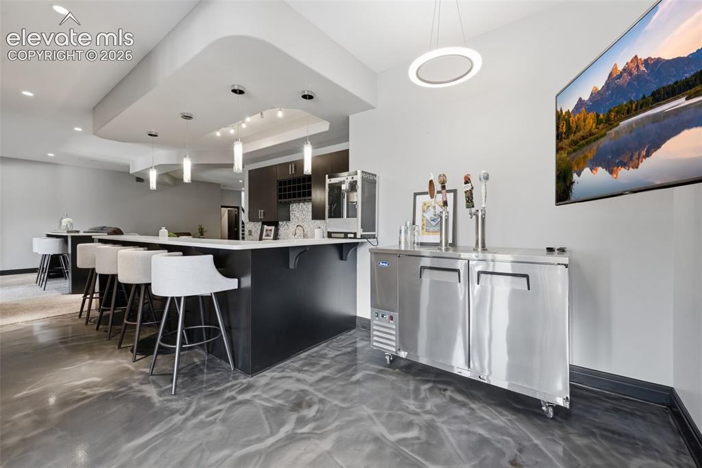 Image 33 of 48: wet bar with beer tap!