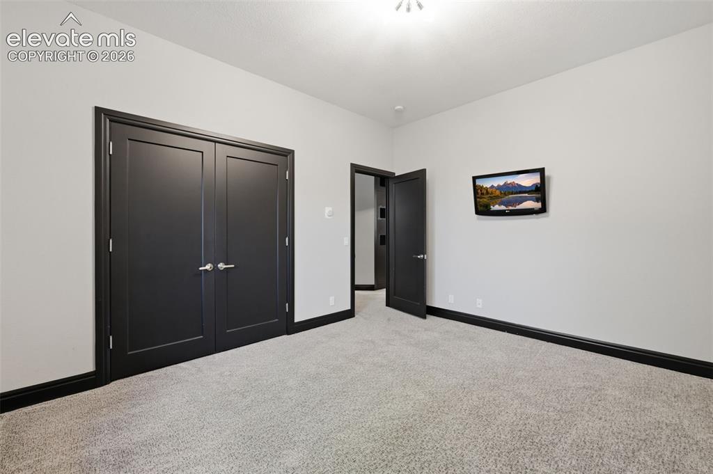 Image 37 of 48: Bedroom #3 in the basement with Jack-n-Jill bath!