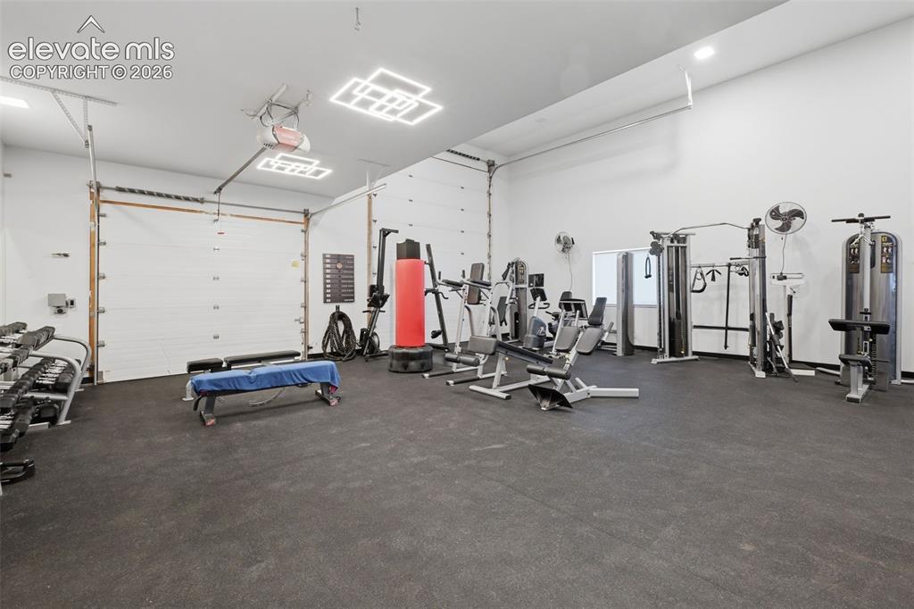 Image 43 of 48: Detached garage being used as a work out room!