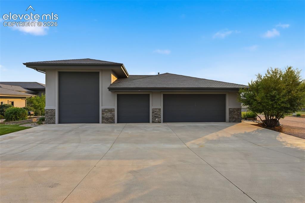 Image 6 of 48: Detached garage with RV parking and room for 3-4 other cars! Guest suite w
