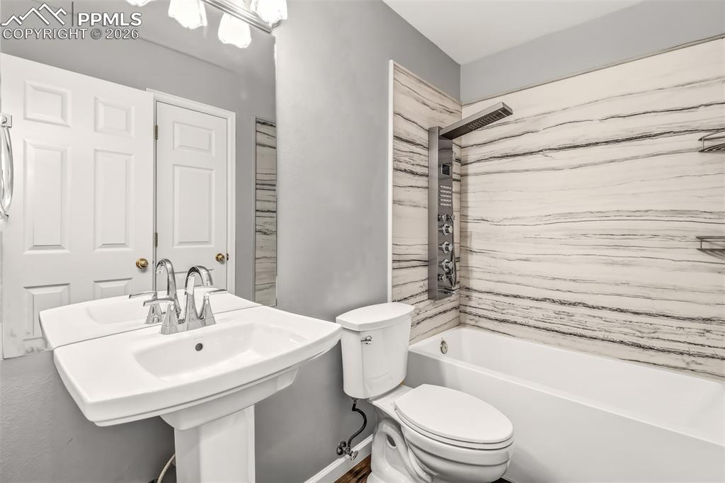 Image 17 of 27: Full bathroom featuring an upgraded bathtub / shower combination with moder