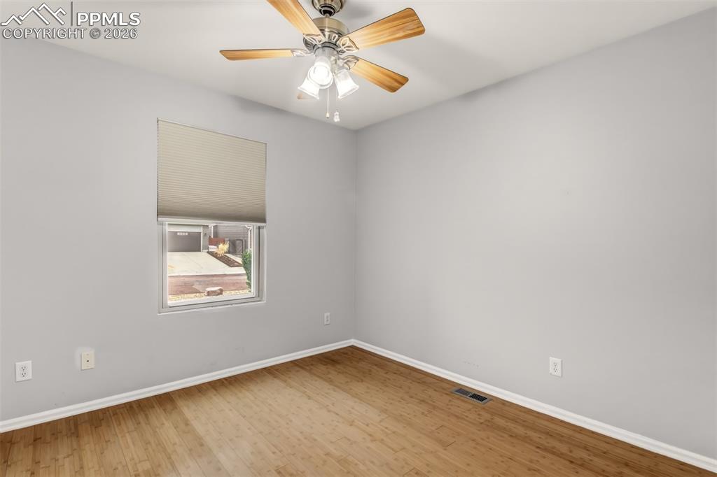 Image 19 of 27: Bedroom 3 featuring light wood-style floors and a ceiling fan