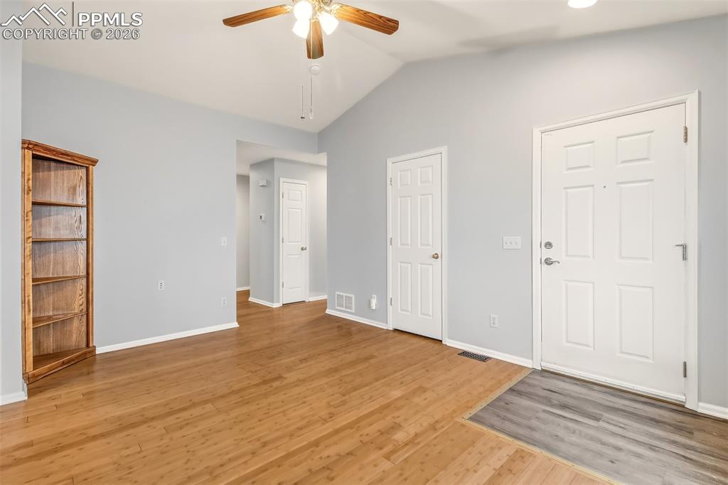 Image 4 of 27: Unfurnished bedroom featuring lofted ceiling, light wood finished floors, a