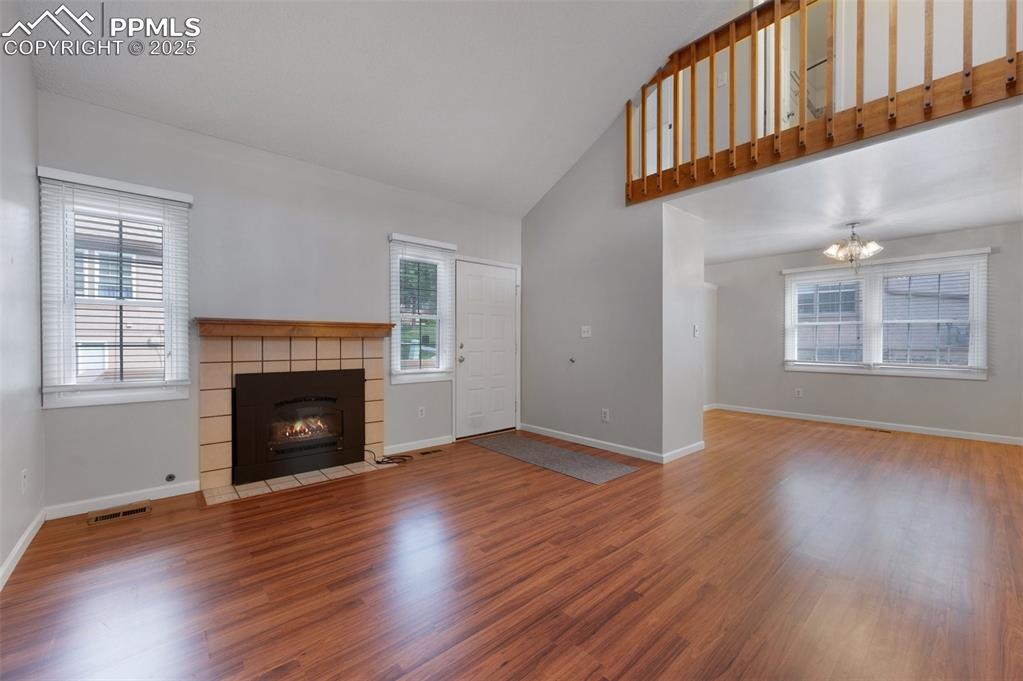Image 2 of 39: Living room with fireplace