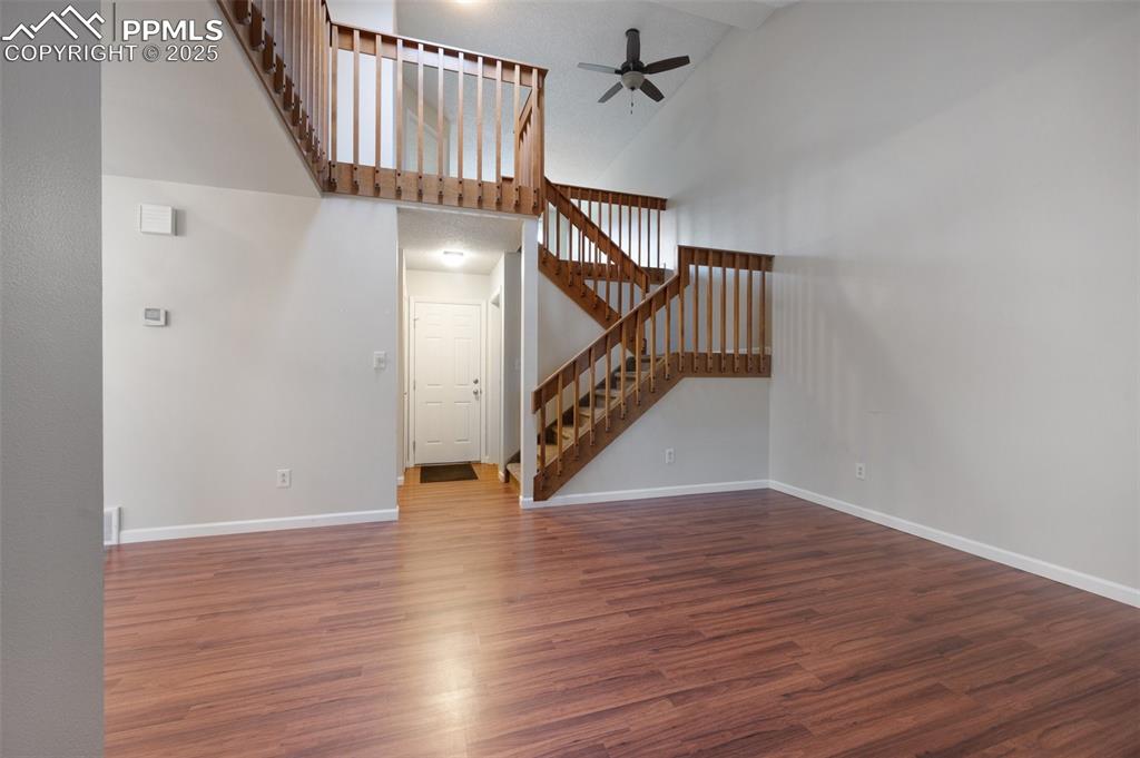 Image 3 of 39: Living room with wood laminate floors