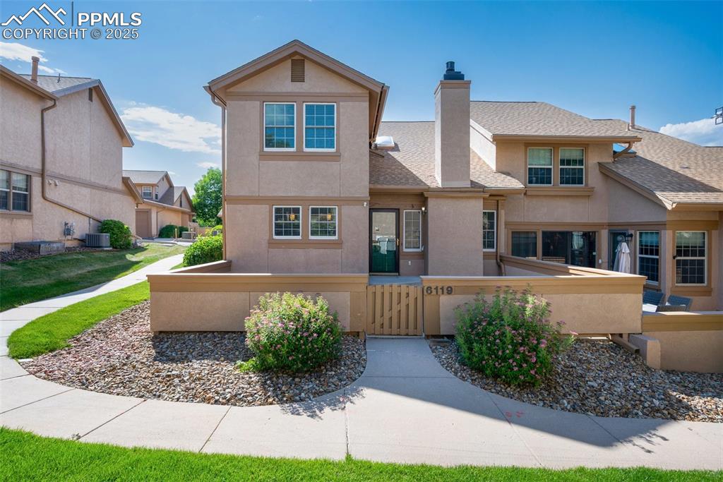 Image 34 of 39: End unit & spaced from other townhomes.