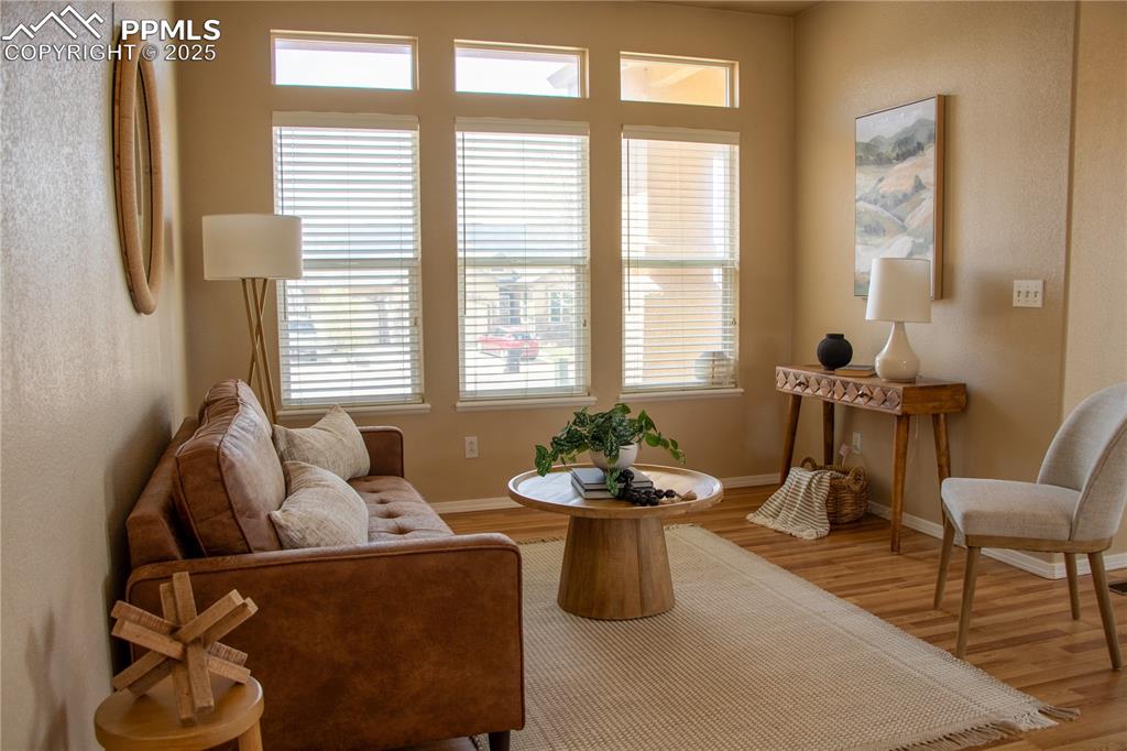 Image 5 of 31: Living area with wood finished floors