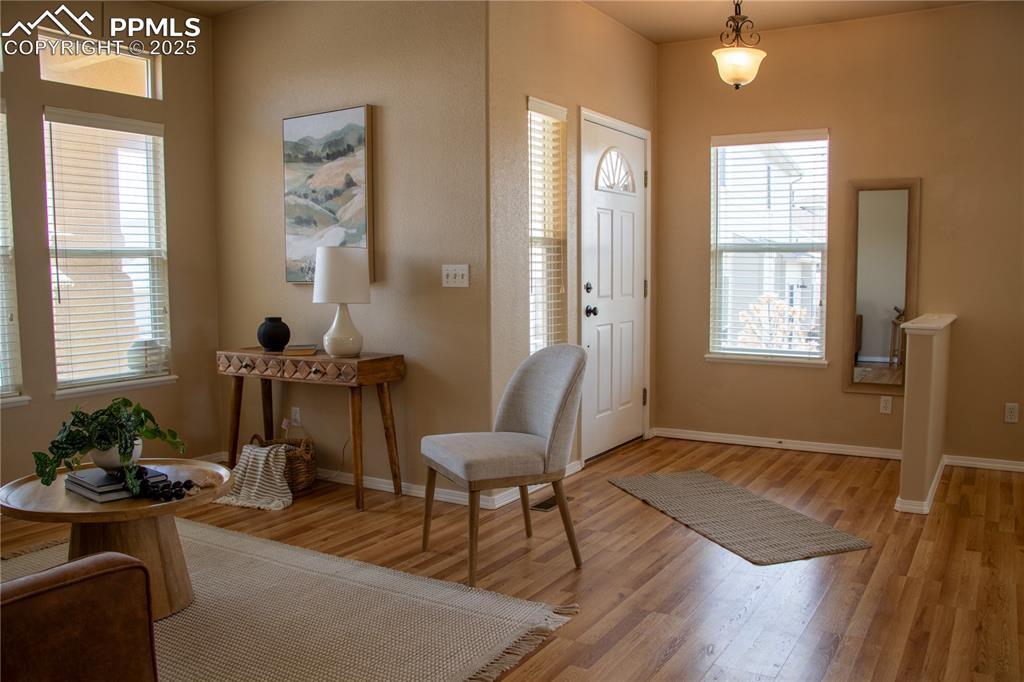 Image 6 of 31: Foyer with light wood-style floors