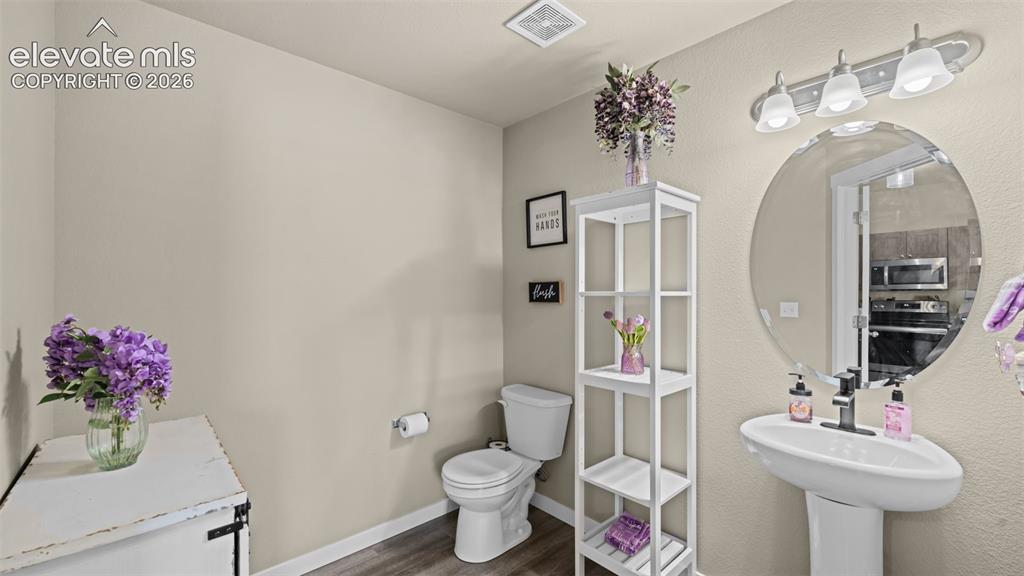 Image 9 of 18: Main level powder room