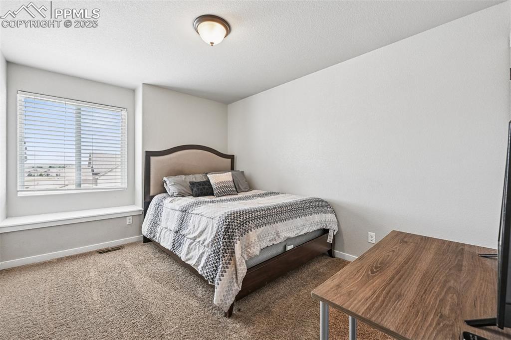 Image 21 of 38: Bedroom