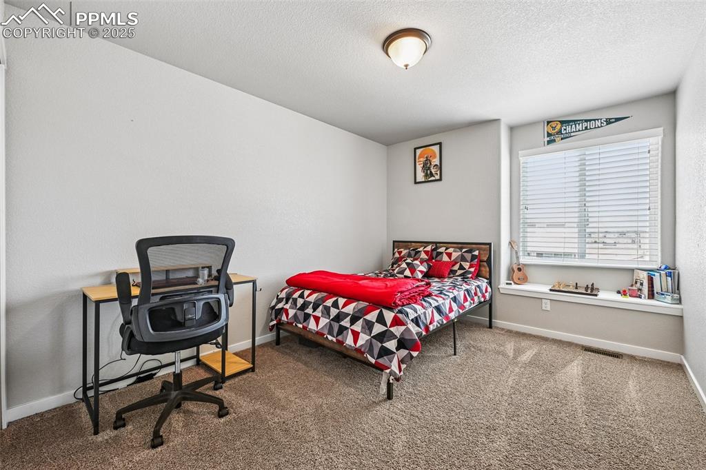 Image 24 of 38: Bedroom