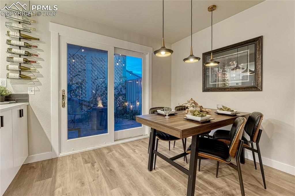 Image 10 of 50: Dining room walks out to the privacy fenced patio