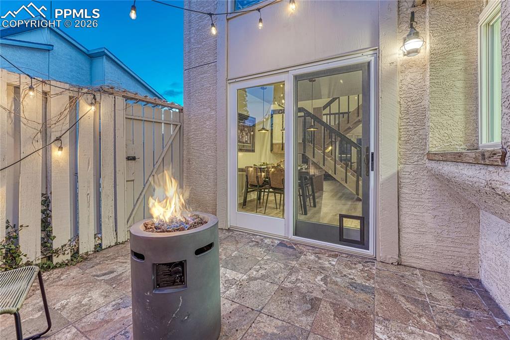Image 35 of 50: A gate to the exterior side yard and back yard