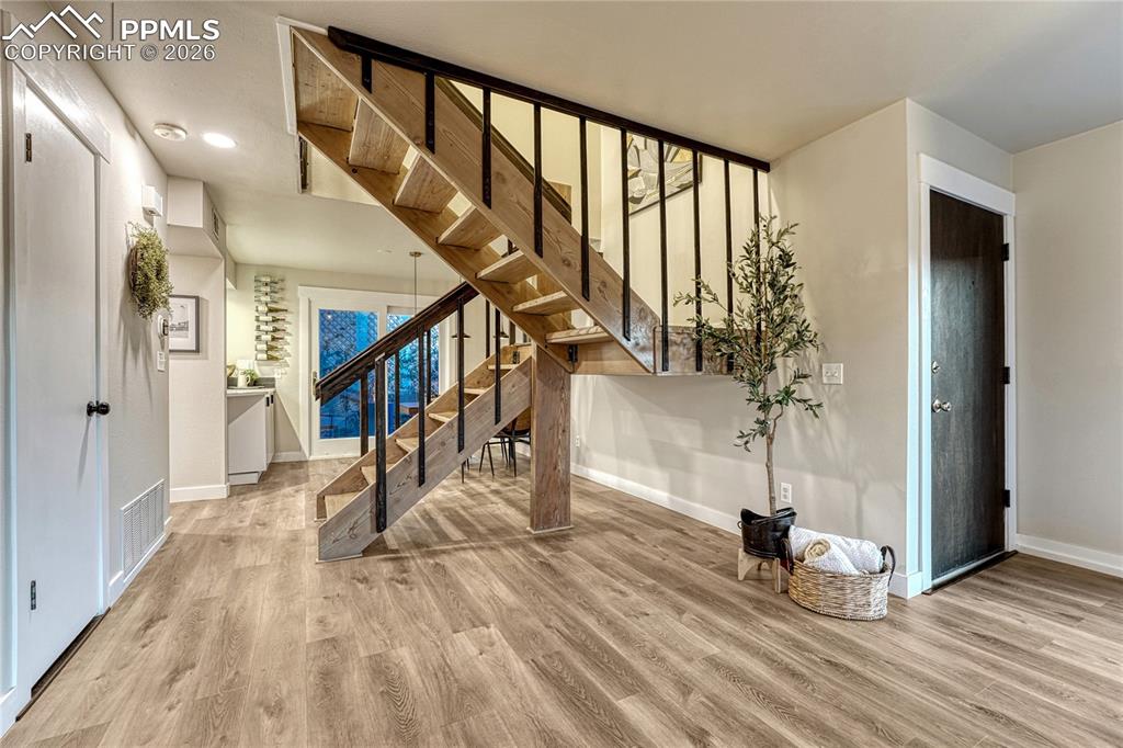 Image 8 of 50: Open Floor plan with Loft Vibe stairway to the upper level