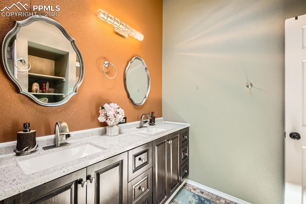 Image 16 of 31: Upstairs bathroom with en suite access to primary