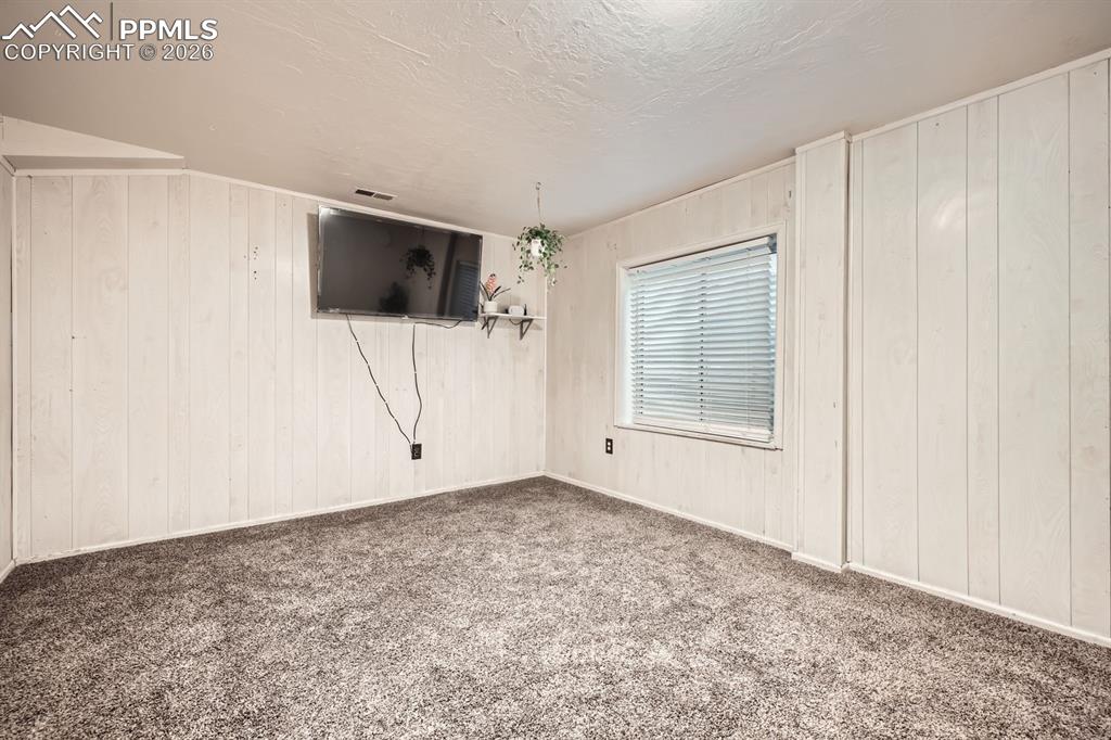 Image 23 of 31: Family room in basement