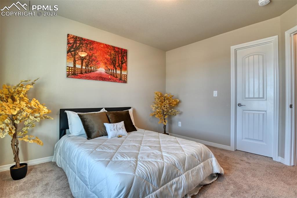 Image 24 of 32: 4th bedroom with a walk-in closet