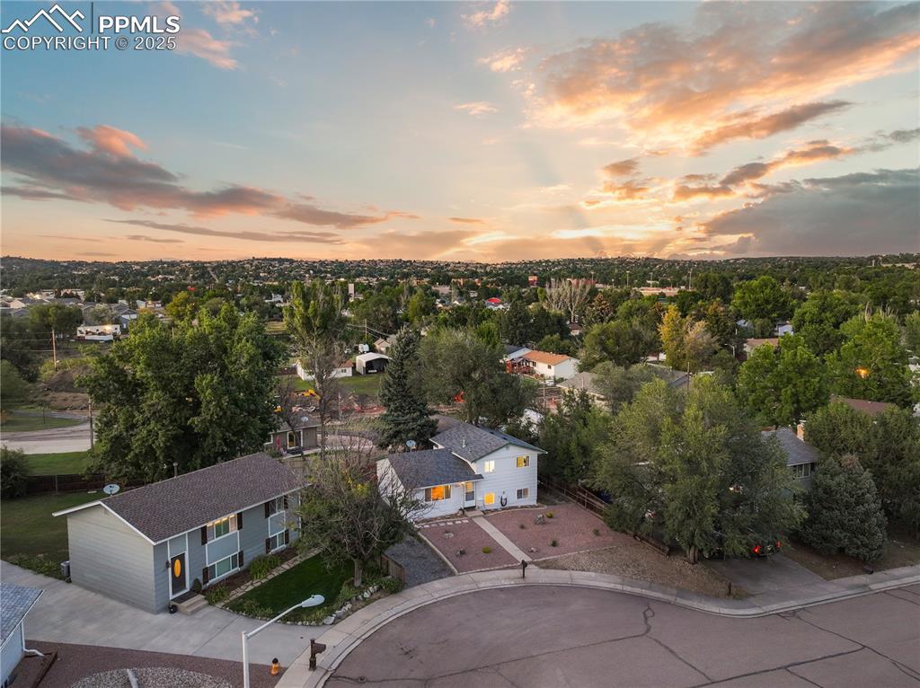 Image 3 of 32: Aerial view at dusk of a residential view