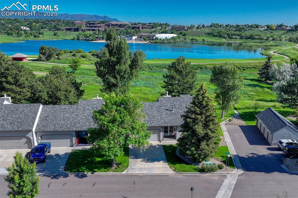 Caption: Lovely end unit location backing to the grass area and golf course.