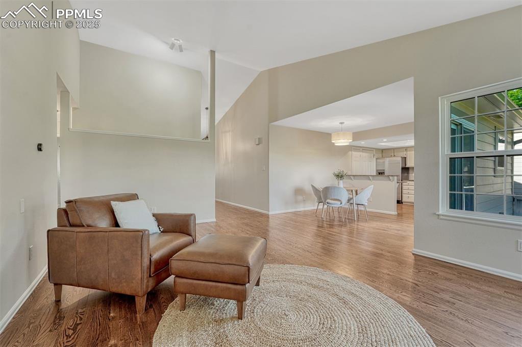 Image 10 of 50: Beautiful hardwood floors and tall ceiling in the Living Room.