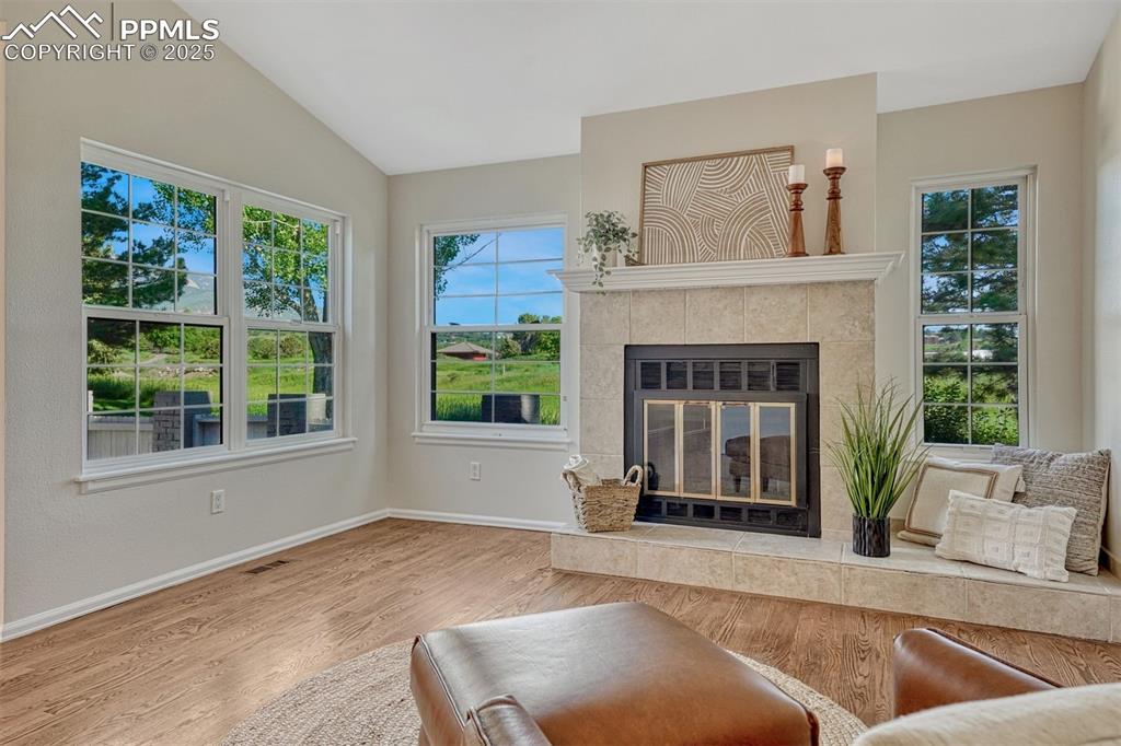 Image 2 of 50: Inviting Gas Fireplace in Living Room.