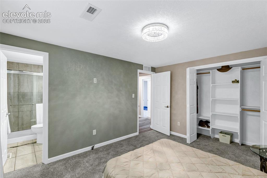 Image 14 of 46: Bedroom featuring a newly carpeted floor, classy sparkles from modern ceili