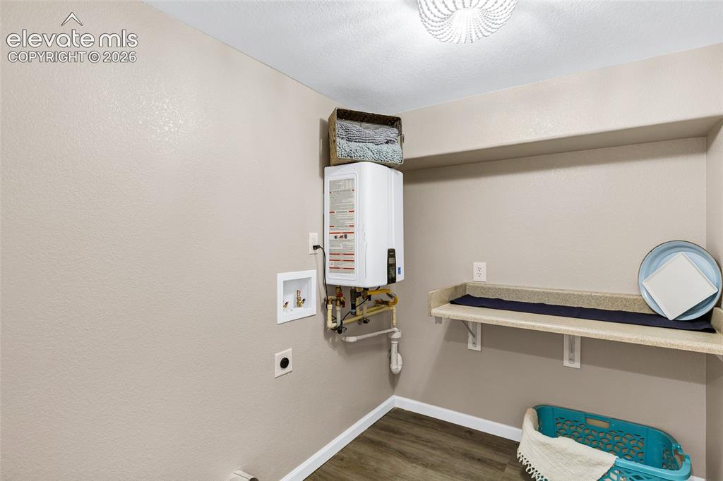 Image 25 of 46: Room featuring three horizontal windows, light wood-finish flooring, recess