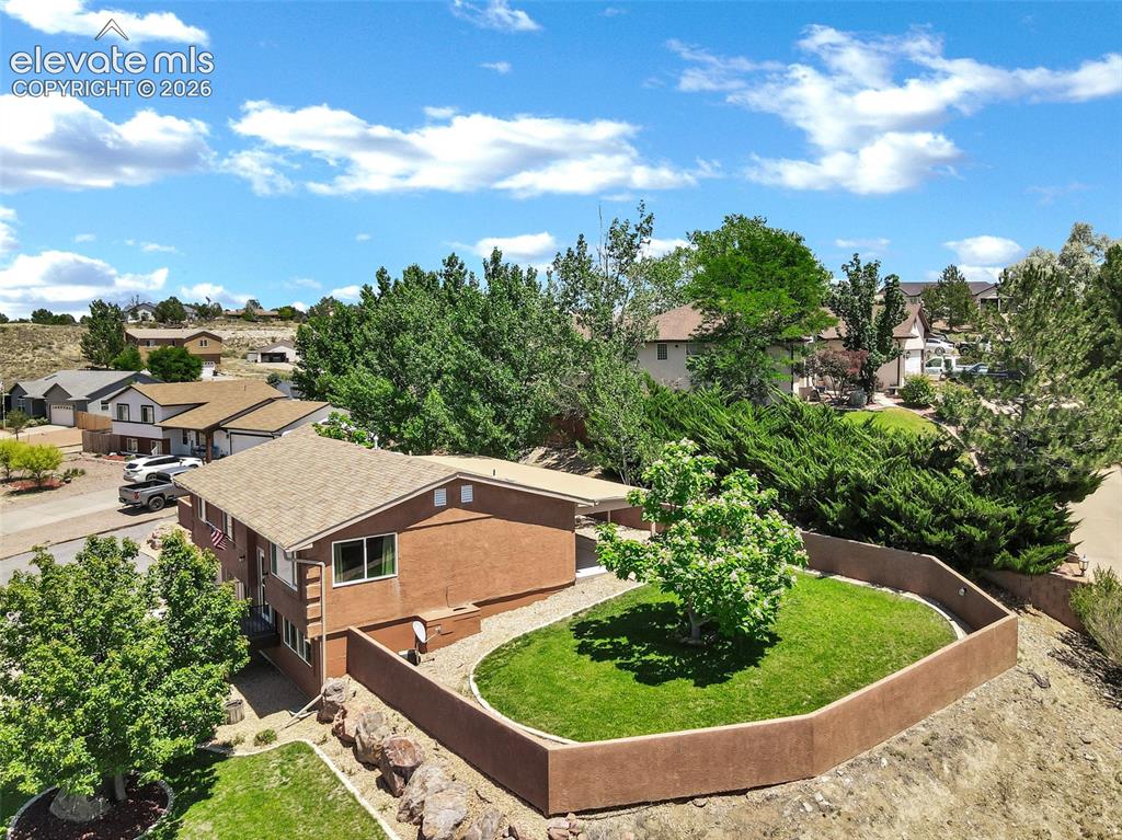 Image 42 of 46: Expansive suburban neighborhood featuring a variety of residential structur