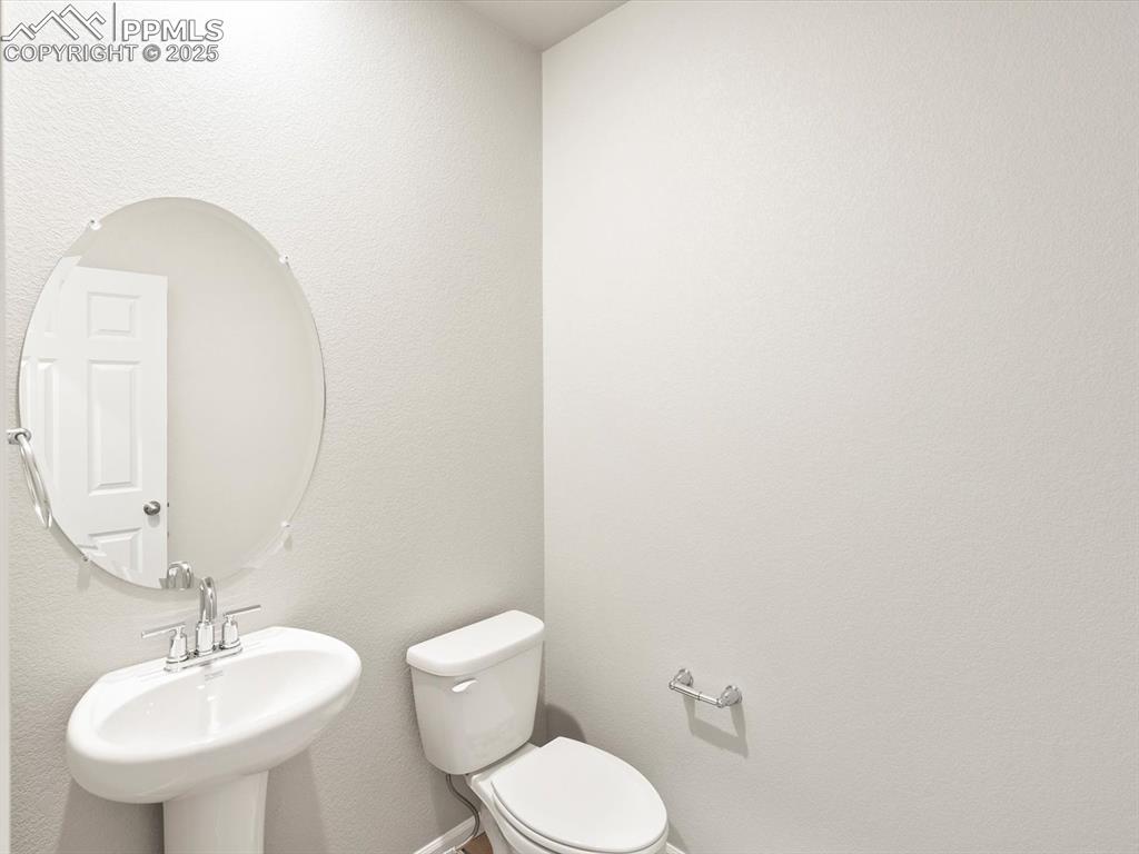 Image 20 of 43: Bathroom featuring toilet and a sink