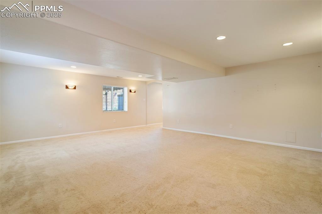 Image 36 of 50: Empty room featuring recessed lighting and light colored carpet