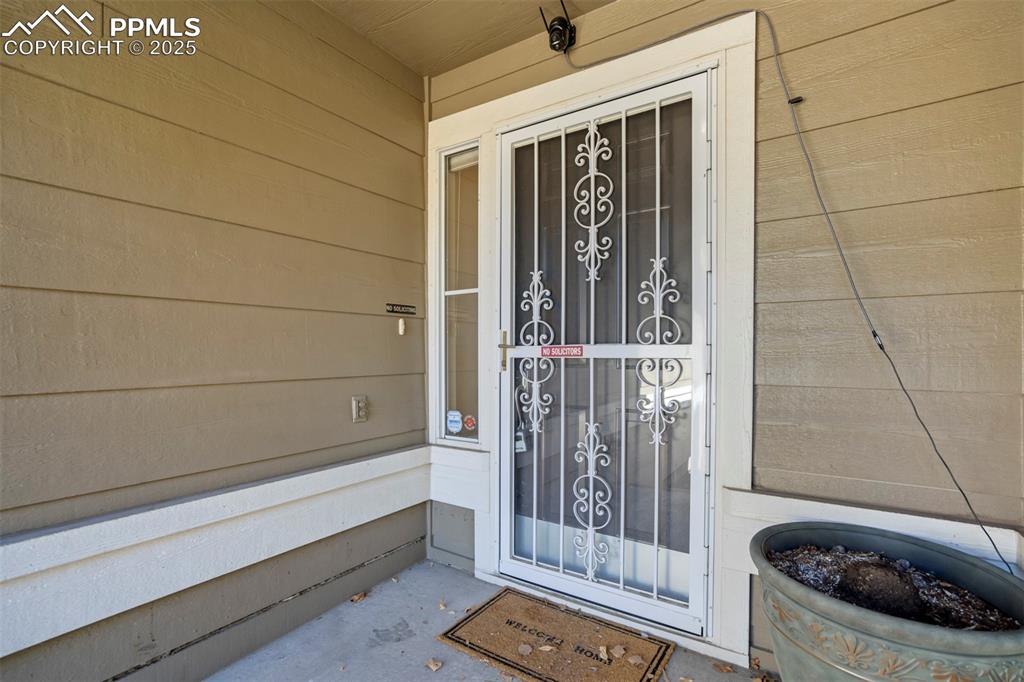 Image 6 of 50: View of exterior entry with covered porch