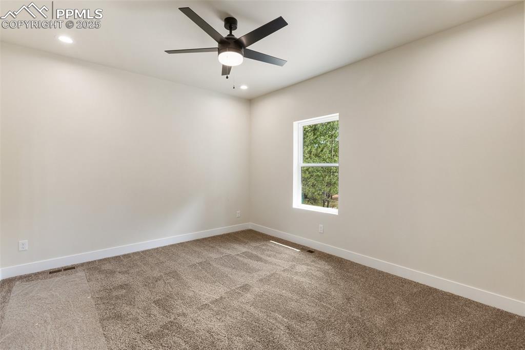 Image 20 of 35: Unfurnished room with recessed lighting, light colored carpet, and ceiling