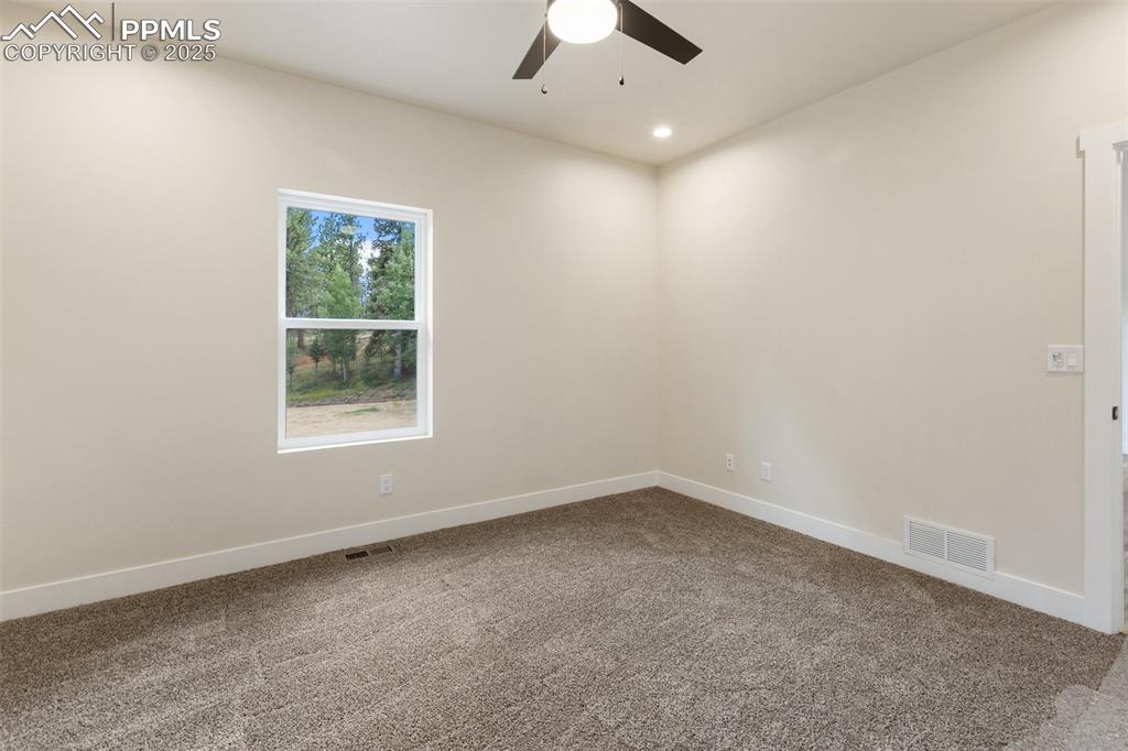 Image 25 of 35: Carpeted spare room featuring recessed lighting and ceiling fan