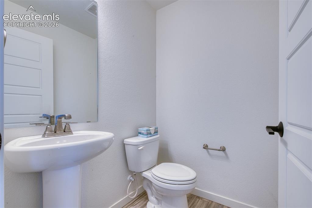 Image 21 of 25: Lower level 1/2 bath