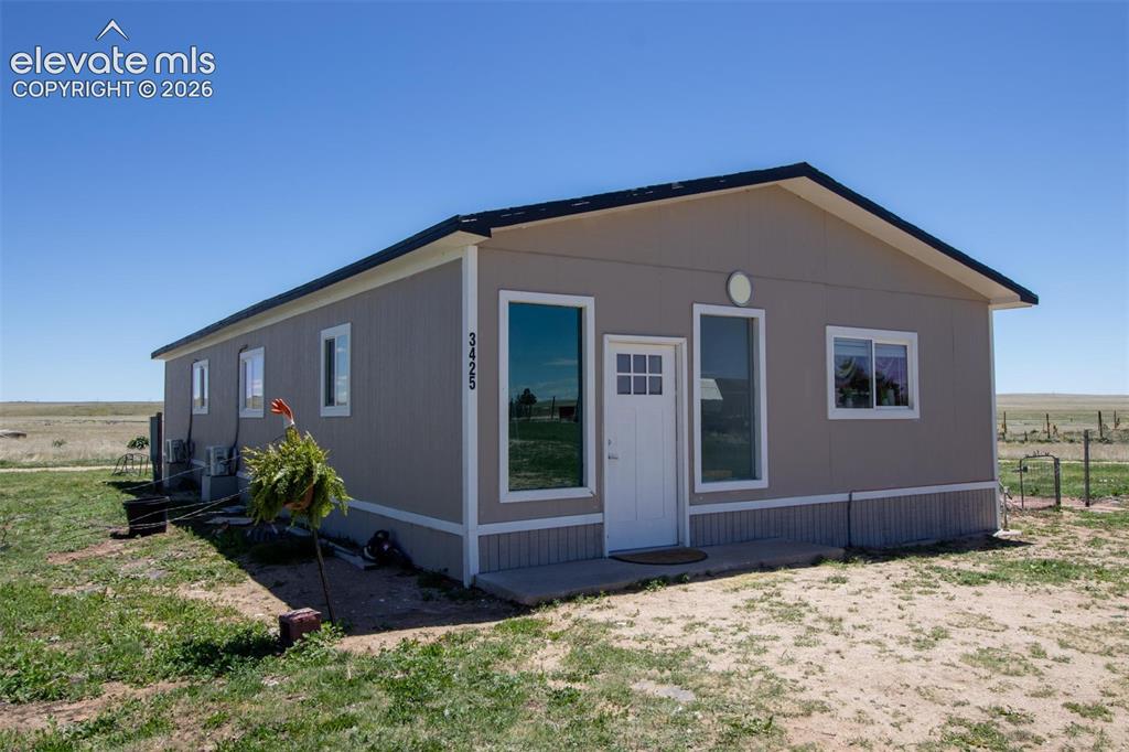 Image 15 of 25: - View of front facade with cooling unit