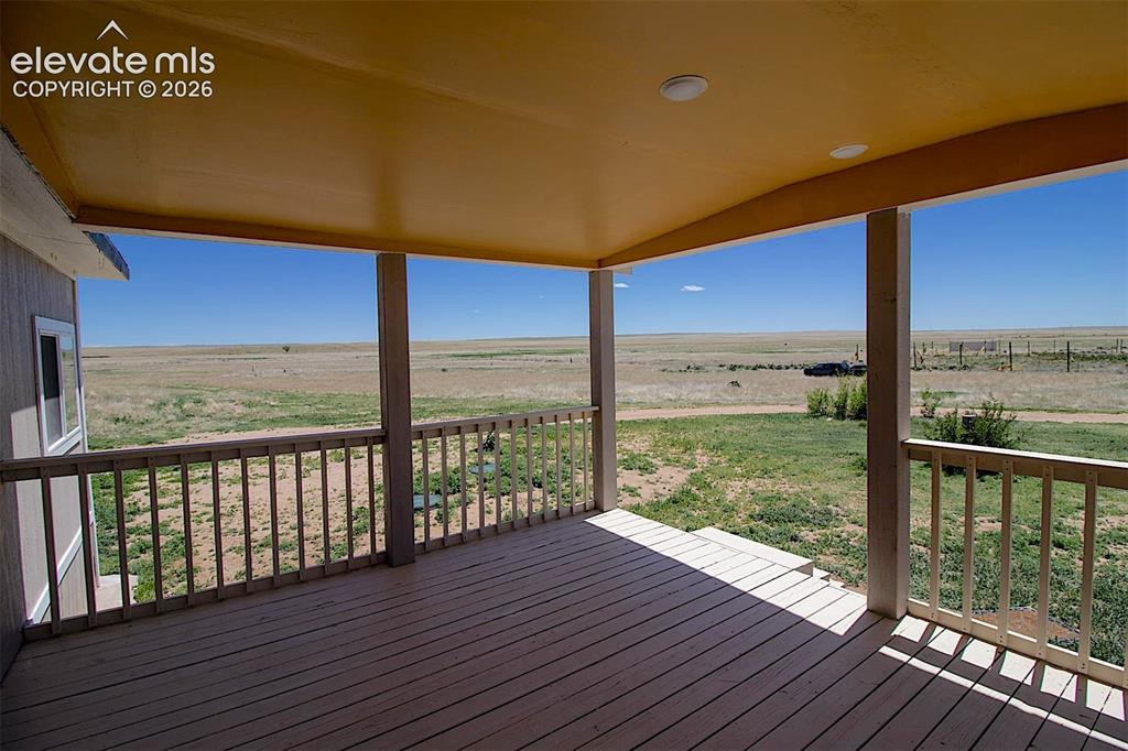Image 17 of 25: Wooden terrace featuring a rural view