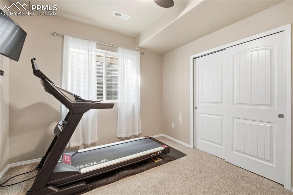 Image 36 of 48: Bedroom used as workout room