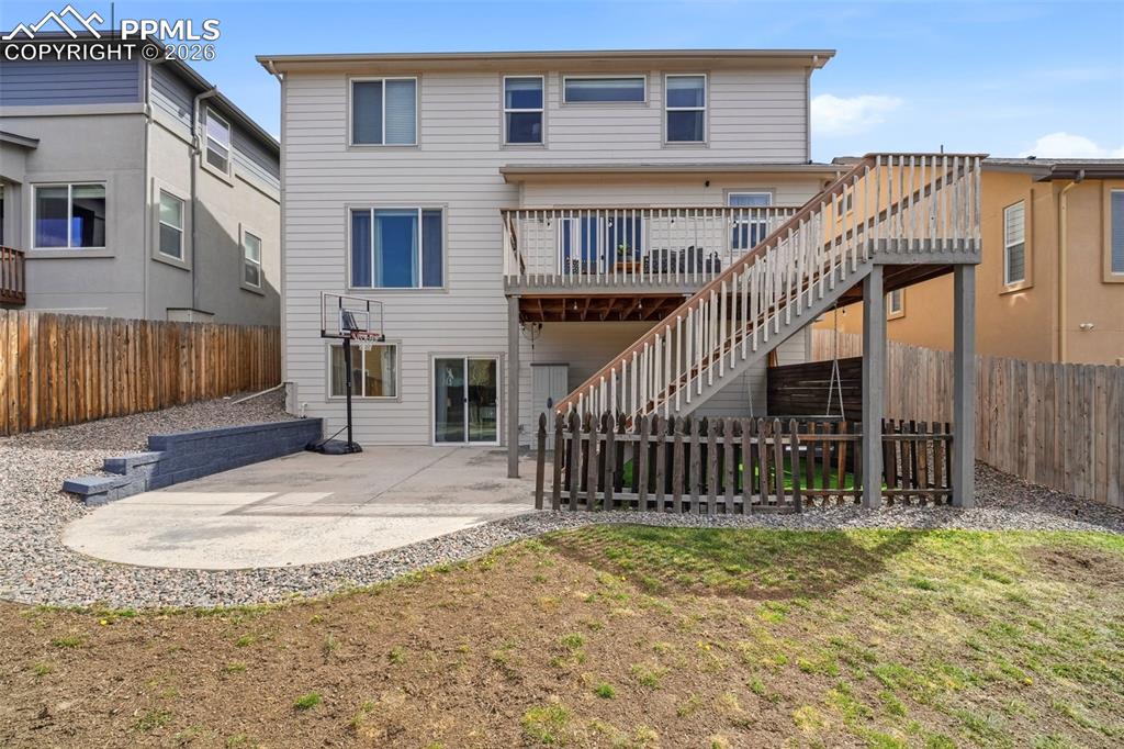 Image 42 of 48: Back of house with a patio area, a fenced backyard, and a deck