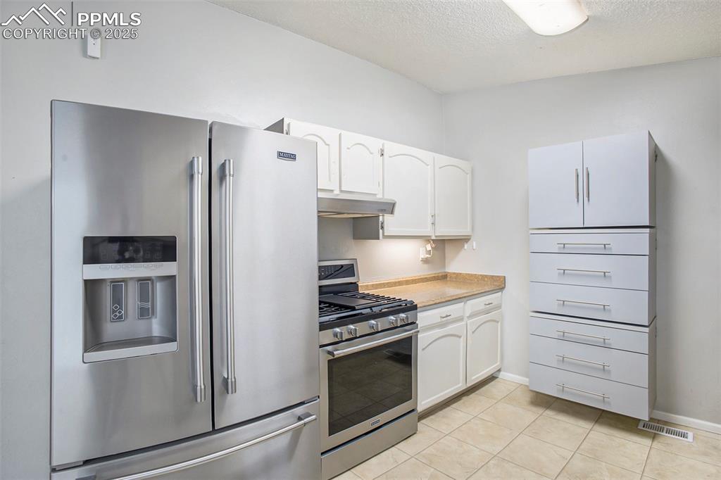 Image 9 of 26: Kitchen with all new stainless steel appliances